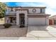 Two-story house with a large garage and desert landscaping at 3109 E Denim Trl, San Tan Valley, AZ 85143