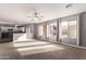 Open living room with kitchen view and backyard access at 3109 E Denim Trl, San Tan Valley, AZ 85143