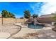 Spacious kidney-shaped pool and waterfall feature at 3109 E Denim Trl, San Tan Valley, AZ 85143