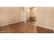 Bright bedroom featuring wood-look floors and mirrored closet at 3255 E Maldonado Dr, Phoenix, AZ 85042