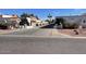 Exterior view of a community of Spanish-style homes with a paved driveway and landscaping at 3401 N 37Th St # 14, Phoenix, AZ 85018