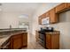 Granite kitchen island with sink and stainless steel appliances at 3635 W Firehawk Dr, Glendale, AZ 85308