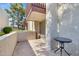 Private patio with small table and surrounding wall at 3828 N 32Nd St # 120, Phoenix, AZ 85018