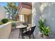 Private patio seating area with table and chairs, perfect for relaxing and enjoying the outdoors at 3828 N 32Nd St # 120, Phoenix, AZ 85018