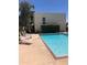 Community pool with lounge chairs and surrounding landscaping at 3828 N 32Nd St # 120, Phoenix, AZ 85018