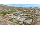 Expansive aerial view highlights a beautiful neighborhood nestled near a golf course with mountain views at 41512 N Tangle Ridge Ct, Anthem, AZ 85086