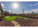 Artificial turf, stone pathway, and desert landscape at 41512 N Tangle Ridge Ct, Anthem, AZ 85086