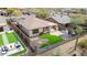 Aerial view of this backyard featuring desert landscaping, an outdoor kitchen, and a built-in seating area at 41512 N Tangle Ridge Ct, Anthem, AZ 85086