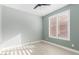 Bedroom with light green walls, wood flooring, and double window with shutters at 41512 N Tangle Ridge Ct, Anthem, AZ 85086