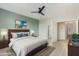 Comfortable bedroom featuring a dark wood bed frame and views to the home's hallway at 41512 N Tangle Ridge Ct, Anthem, AZ 85086