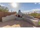 Relaxing backyard fire pit with seating at 41512 N Tangle Ridge Ct, Anthem, AZ 85086