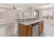 Kitchen island with sink, dishwasher, and ample storage at 41512 N Tangle Ridge Ct, Anthem, AZ 85086