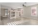 Open concept living room with a partial wall and ceiling fan at 41512 N Tangle Ridge Ct, Anthem, AZ 85086