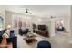 Stylish living room with blue and orange accents, plush seating, and a modern coffee table at 41512 N Tangle Ridge Ct, Anthem, AZ 85086