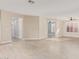 Bright and airy living area with large windows and wood floors at 41512 N Tangle Ridge Ct, Anthem, AZ 85086