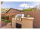 Built-in stainless steel grill and stone countertops at 41512 N Tangle Ridge Ct, Anthem, AZ 85086