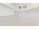 Bright walk-in closet with double hanging rods and light wood flooring at 41512 N Tangle Ridge Ct, Anthem, AZ 85086