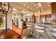 Breakfast bar and kitchen with granite counters and high-end appliances at 41686 N 110Th Way, Scottsdale, AZ 85262