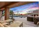 Relaxing patio with lounge chairs and a view of the pool and mountains at 41686 N 110Th Way, Scottsdale, AZ 85262