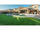 Backyard oasis with pool, pergola, and turf at 44049 W Palo Nuez St, Maricopa, AZ 85138