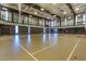 Indoor basketball court with seating and markings at 44049 W Palo Nuez St, Maricopa, AZ 85138