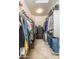 Large walk-in closet with shelving and safe at 44049 W Palo Nuez St, Maricopa, AZ 85138
