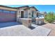 Charming home with a welcoming front porch and two-car garage at 44049 W Palo Nuez St, Maricopa, AZ 85138