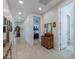 Bright hallway with wood-look tile flooring and access to bedrooms at 44049 W Palo Nuez St, Maricopa, AZ 85138