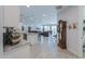 Open concept kitchen with island, granite countertops, and stainless steel appliances at 44049 W Palo Nuez St, Maricopa, AZ 85138