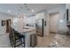 Modern kitchen with island, granite countertops and stainless steel appliances at 44049 W Palo Nuez St, Maricopa, AZ 85138