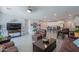 Bright living room with hardwood floors, leather furniture and open floor plan at 44049 W Palo Nuez St, Maricopa, AZ 85138