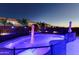 Beautifully lit pool and landscape offering a relaxing and private backyard retreat at 44049 W Palo Nuez St, Maricopa, AZ 85138