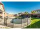 Backyard with a circular pool and fenced area, providing a private and secure space for relaxation at 44049 W Palo Nuez St, Maricopa, AZ 85138
