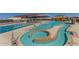 Community pool area with lap lanes, water features, and a waterslide at 44049 W Palo Nuez St, Maricopa, AZ 85138