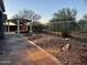 Landscaped backyard with a pergola and pathway at 5822 E Bramble Berry Ln, Cave Creek, AZ 85331