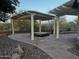 Relaxing backyard patio with pergola, hot tub, and beautiful landscaping at 5822 E Bramble Berry Ln, Cave Creek, AZ 85331