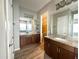 Elegant bathroom with double vanity and access to a walk-in closet at 5822 E Bramble Berry Ln, Cave Creek, AZ 85331