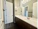Bathroom with single vanity and dark brown cabinets at 5822 E Bramble Berry Ln, Cave Creek, AZ 85331