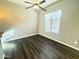 Bright bedroom with wood-look flooring and a ceiling fan at 5822 E Bramble Berry Ln, Cave Creek, AZ 85331