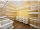Large walk-in closet with ample shelving and storage at 5822 E Bramble Berry Ln, Cave Creek, AZ 85331