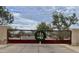 Gated community entrance with rustic metal gate at 5822 E Bramble Berry Ln, Cave Creek, AZ 85331