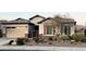 Single-story home with desert landscaping and a two-car garage at 5822 E Bramble Berry Ln, Cave Creek, AZ 85331