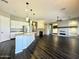 Open concept kitchen with island, granite counters & stainless steel appliances at 5822 E Bramble Berry Ln, Cave Creek, AZ 85331