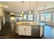 Open concept kitchen with island, granite counters & stainless steel appliances at 5822 E Bramble Berry Ln, Cave Creek, AZ 85331