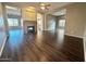 Open living room with hardwood floors and a fireplace at 5822 E Bramble Berry Ln, Cave Creek, AZ 85331