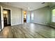 Spacious main bedroom with wood-look tile flooring and ensuite bathroom at 5822 E Bramble Berry Ln, Cave Creek, AZ 85331