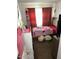 Bright bedroom with a bed, dresser, and window coverings at 5954 W Townley Ave, Glendale, AZ 85302