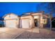 Two-car garage home with well-maintained front yard at 6321 N Oro Vista Ct, Litchfield Park, AZ 85340