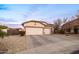 Two-car garage home with nicely landscaped front yard at 6321 N Oro Vista Ct, Litchfield Park, AZ 85340