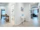 Clean hallway with white console table and bathroom access at 6321 N Oro Vista Ct, Litchfield Park, AZ 85340